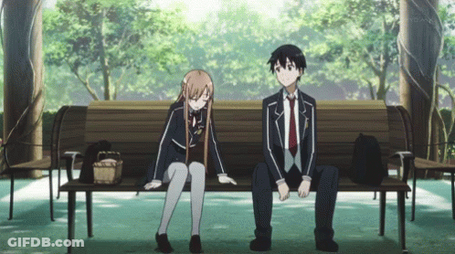 A Boy And A Girl Sit On A Park Bench GIF