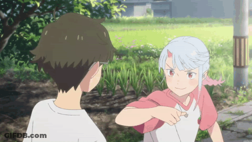A Boy And A Girl Standing Next To Each Other GIF
