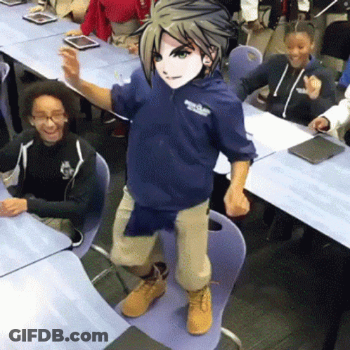 A Boy In A Blue Hoodie Is Standing On A Chair In Front Of A Classroom Full Of Children . GIF