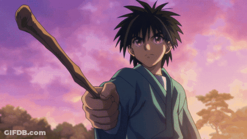 A Boy In A Blue Shirt Holds A Wooden Stick In His Right Hand GIF