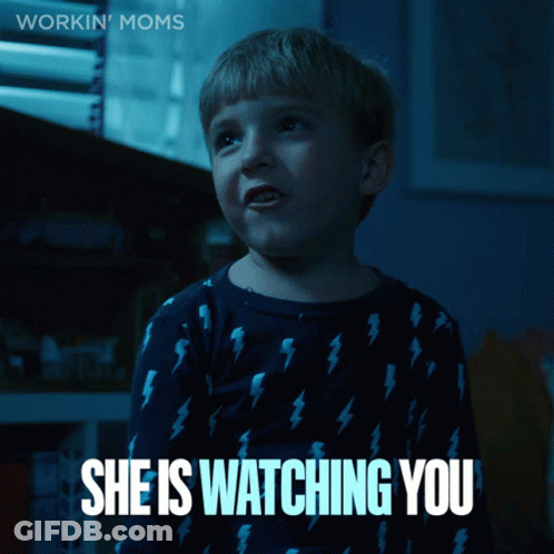 A Boy In A Blue Shirt With Lightning Bolts On It Says " She Is Watching You " GIF