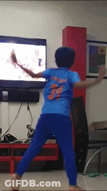 A Boy In A Blue Shirt With The Number 3 On The Back Is Playing A Video Game GIF
