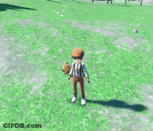 A Boy In A Hat Stands Next To A Sheep In A Grassy Field GIF