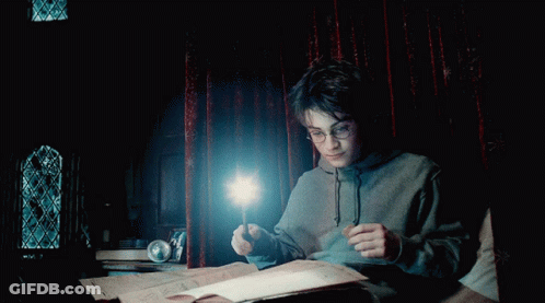 A Boy In A Hoodie Is Holding A Wand In His Hand GIF