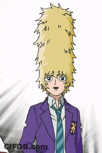 A Boy In A Purple Suit And Tie Has A K On His Chest GIF