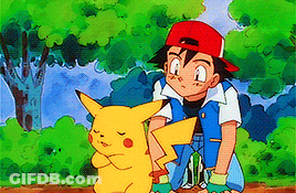 A Boy In A Red Hat Is Kneeling Next To A Pikachu In A Forest . GIF
