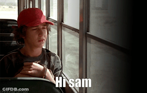 A Boy In A Red Hat Is Sitting On A Bus With The Words Hi Sam Below Him GIF