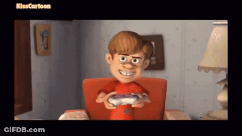 A Boy In A Red Shirt Is Holding A Video Game Controller While Sitting In A Chair .. GIF