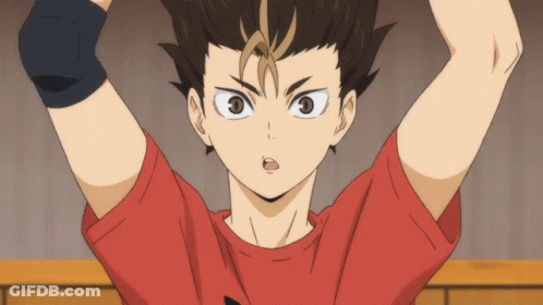 A Boy In A Red Shirt Is Looking At The Camera GIF