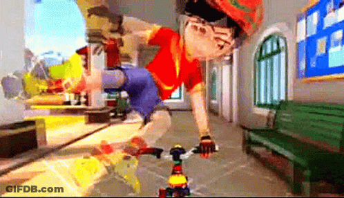 A Boy In A Red Shirt Is Riding A Bike Down A Hallway GIF