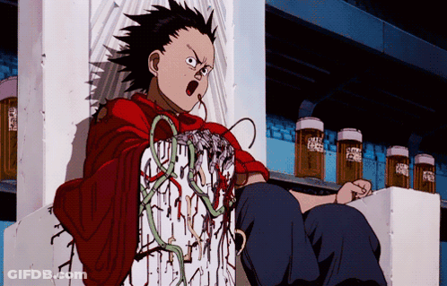 A Boy In A Red Shirt Is Sitting On A Shelf With A Few Bottles Of Beer In The Background GIF