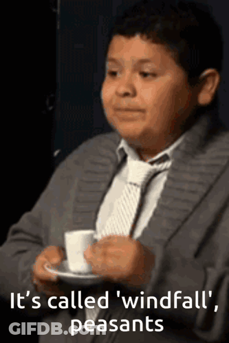 A Boy In A Suit And Tie Is Holding A Cup Of Coffee With The Words It 'S Called Windfall Peasants On The Bottom GIF