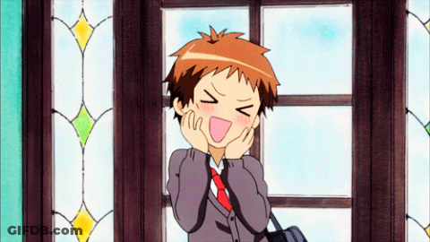 A Boy In A Suit And Tie Is Making A Funny Face With His Eyes Closed GIF