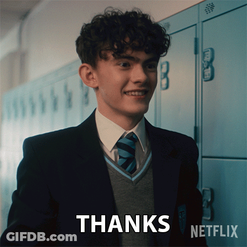 A Boy In A Suit And Tie Says Thanks GIF