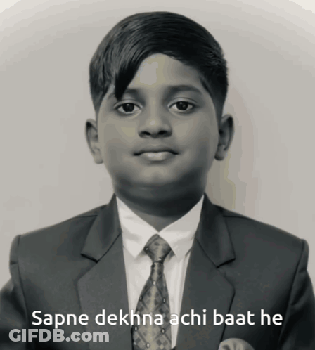 A Boy In A Suit And Tie With The Words Sapne Dekhna Achi Baat He Below Him GIF