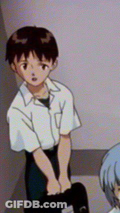 A Boy In A White Shirt Is Standing Next To A Girl In A Blue Dress . GIF