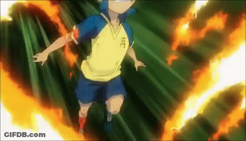 A Boy In A Yellow Shirt And Blue Shorts Is Flying Through The Air Surrounded By Flames . GIF