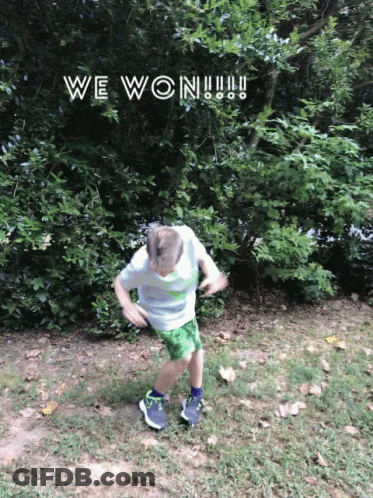 A Boy In Green Shorts Is Jumping In The Air With The Words We Won Written Above Him GIF