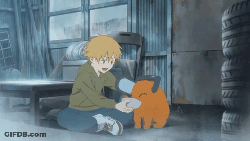 A Boy Is Kneeling Down Next To A Stuffed Animal That Looks Like A Dog GIF