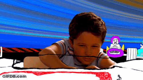 A Boy Is Laying On A Drawing Of A Race Track With #Speedracer Written On The Bottom GIF