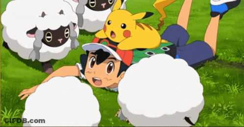 A Boy Is Laying On The Grass With A Pikachu On His Head GIF