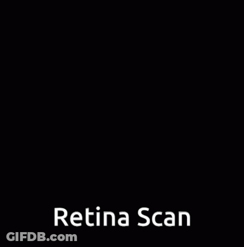 A Boy Is Looking Through A Magnifying Glass With The Words Retina Scan Written Below Him GIF