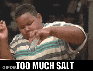 A Boy Is Pouring Salt Into His Mouth With The Words Too Much Salt Below Him GIF