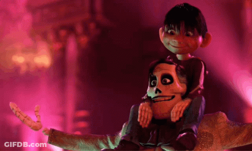 A Boy Is Sitting On A Skeleton 'S Shoulders In A Dark Room GIF