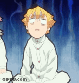 A Boy Is Sitting On The Floor With His Eyes Closed . GIF