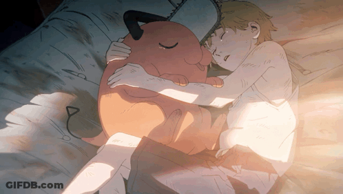 A Boy Is Sleeping With A Stuffed Animal That Looks Like A Devil GIF