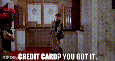 A Boy Is Standing In A Room With The Words `` Credit Card ? You Got It '' Written On The Bottom . GIF