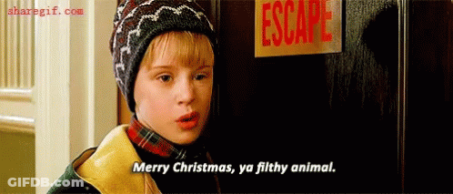 A Boy Is Standing In Front Of A Door With A Sign That Says Escape . GIF