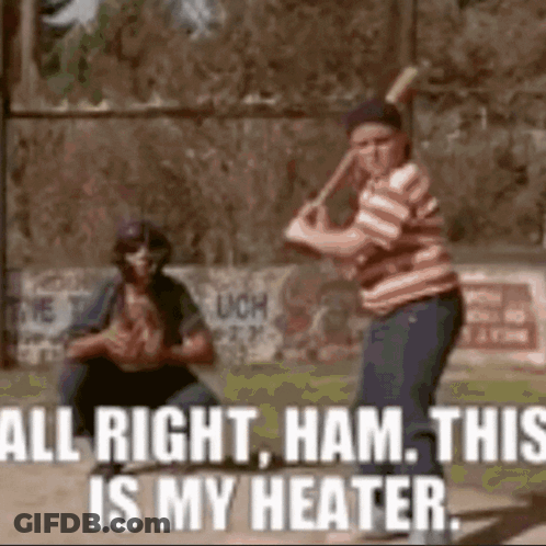 A Boy Is Swinging A Baseball Bat On A Baseball Field While Another Boy Watches . GIF
