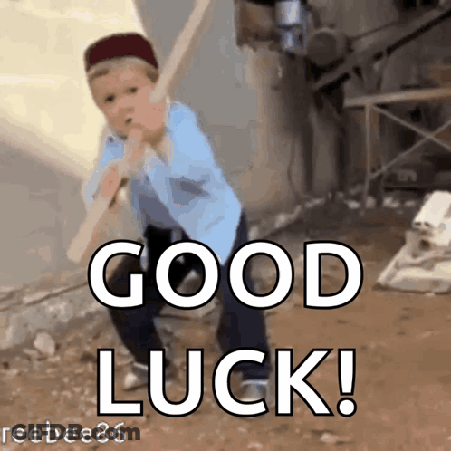 A Boy Is Swinging A Bat With The Words " Good Luck " Behind Him GIF