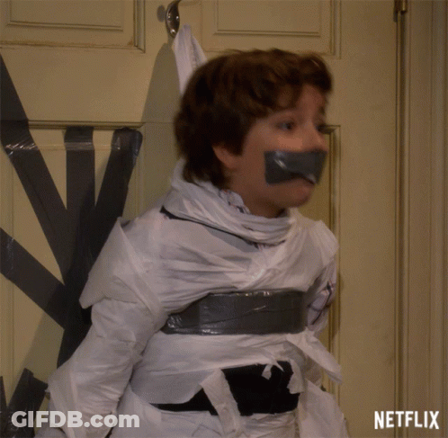 A Boy Is Taped To A Door With Duct Tape And A Netflix Logo Behind Him GIF