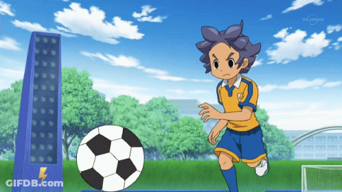 A Boy Kicks A Soccer Ball In Front Of A Bs Japan Tower GIF