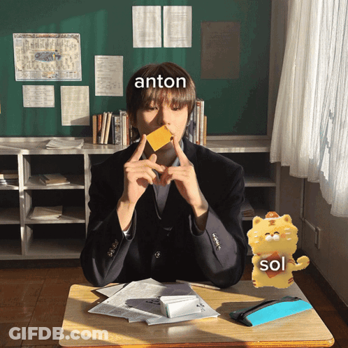 Boy Sitting At Desk With Anton Written On Forehead GIF
