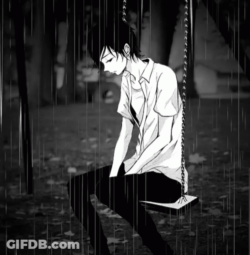 A Boy Sitting On A Swing In The Rain GIF