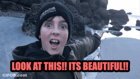 A Boy Wearing A Black Beanie Says Look At This GIF