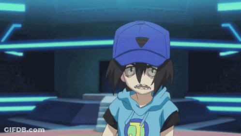 A Boy Wearing A Blue Hat With A Triangle On It GIF