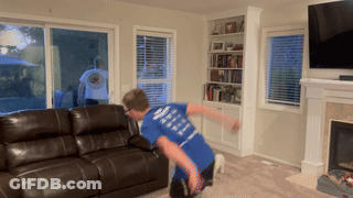 A Boy Wearing A Blue Shirt That Says ' I Love You ' On The Back GIF