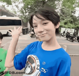 A Boy Wearing A Blue Shirt With The Number 4 On The Front GIF