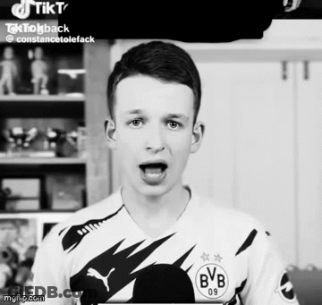 A Boy Wearing A Bvb 09 Jersey Is Making A Funny Face GIF