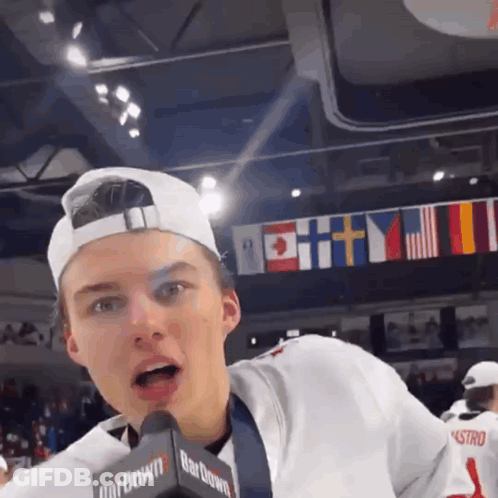 A Boy Wearing A Hat And A Microphone That Says Bardown GIF