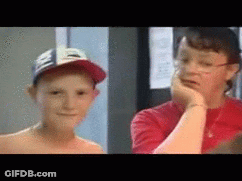 A Boy Wearing A Hat And A Woman Wearing Glasses GIF