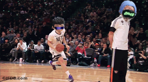 A Boy Wearing A Nets Jersey Dribbles A Basketball On A Court GIF