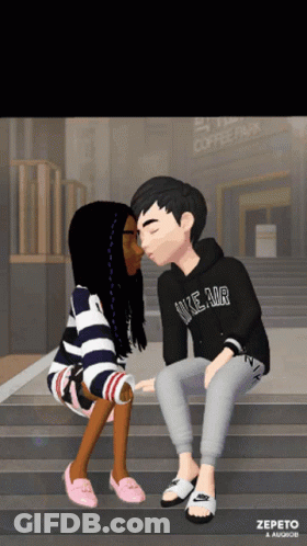 A Boy Wearing A Nike Air Hoodie Kisses A Girl GIF