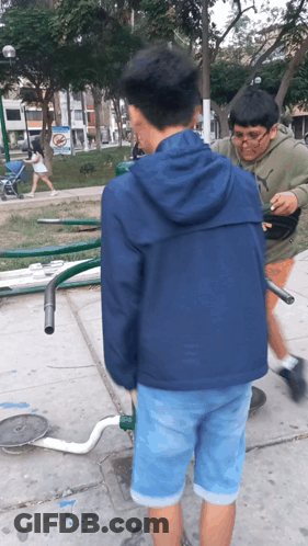 A Boy Wearing A Puma Sweatshirt Stands Next To A Boy Wearing A Blue Jacket GIF
