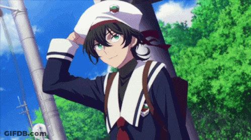 A Boy Wearing A White Hat With A Cherry On It Is Standing Next To A Tree GIF