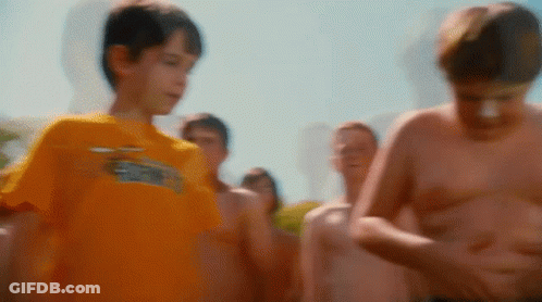 A Boy Wearing A Yellow Shirt With The Word Eagles On It GIF